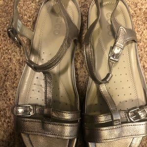 Gold Ecco sandals with straps.